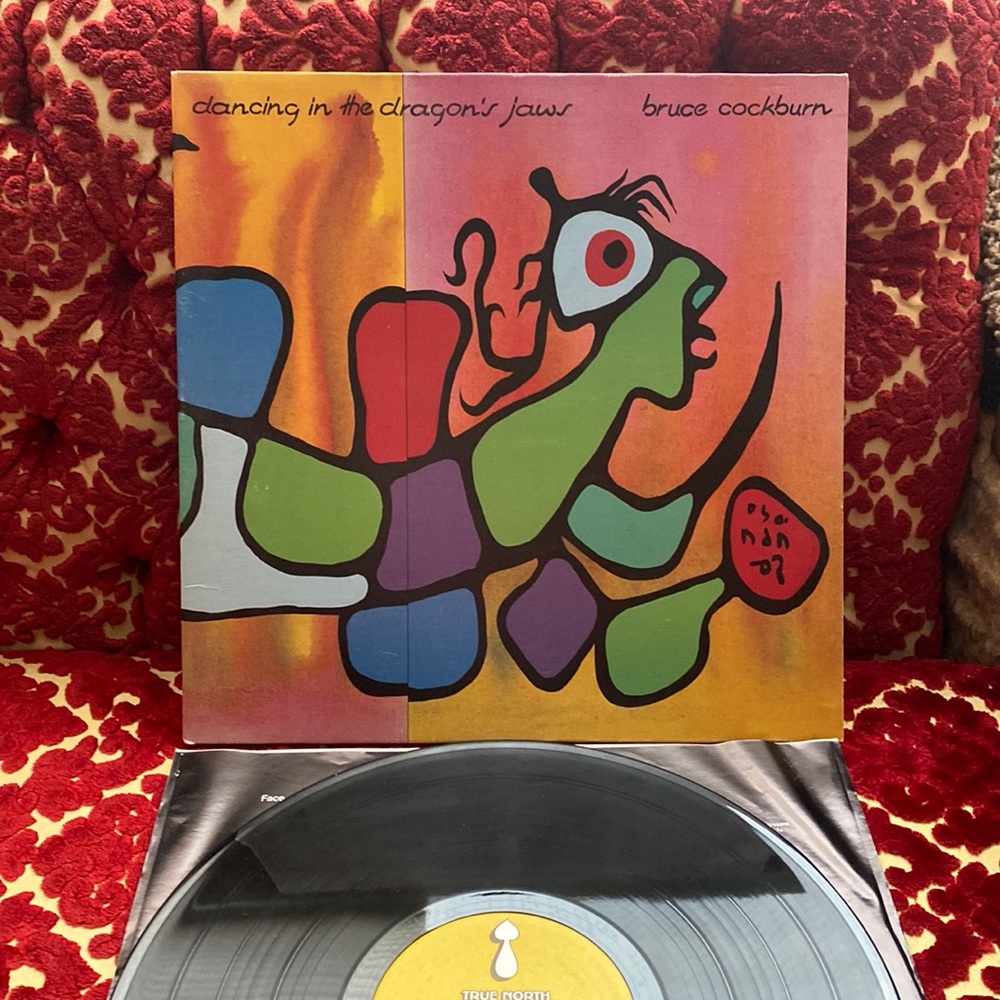 Bruce Cockburn album Dancing in the Dragons Jaws on vinyl.